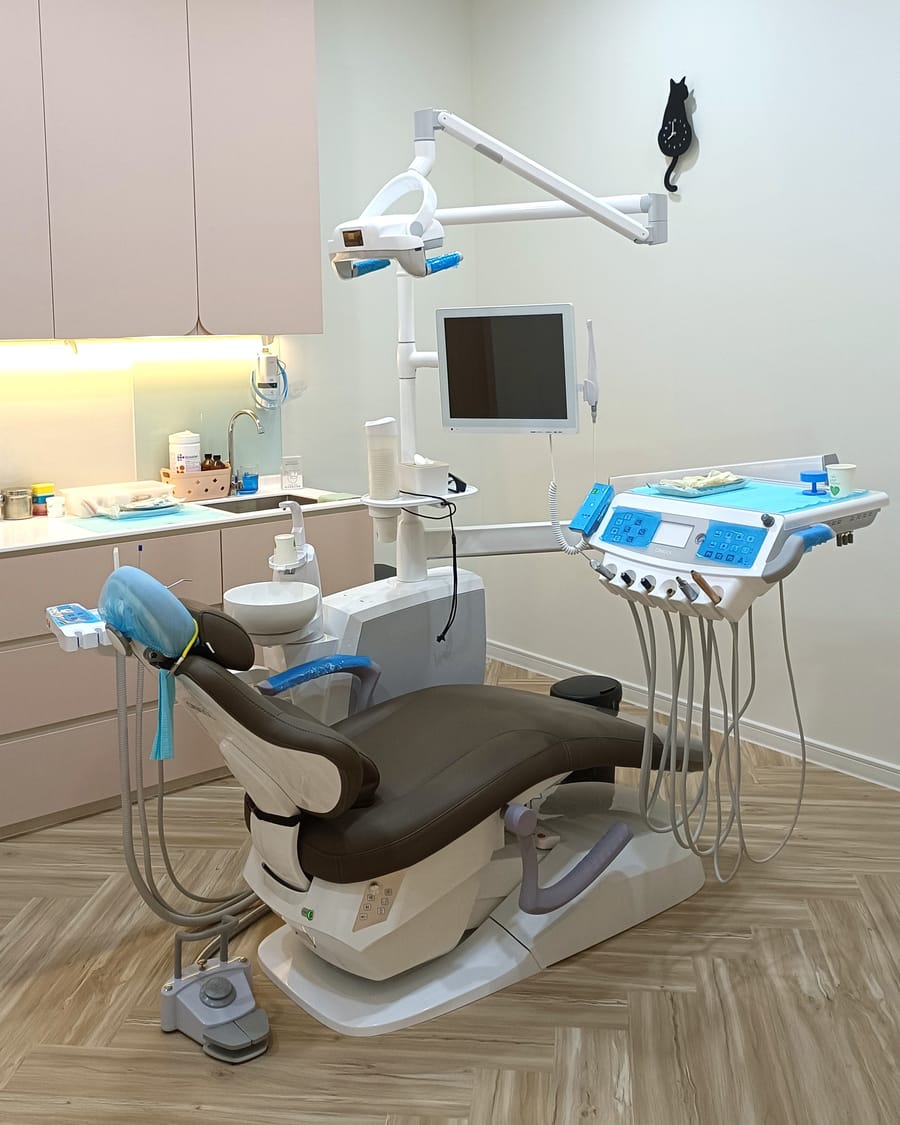 A modern treatment room with a dental chair at Alpha Dental, Sutera Utama, Skudai
