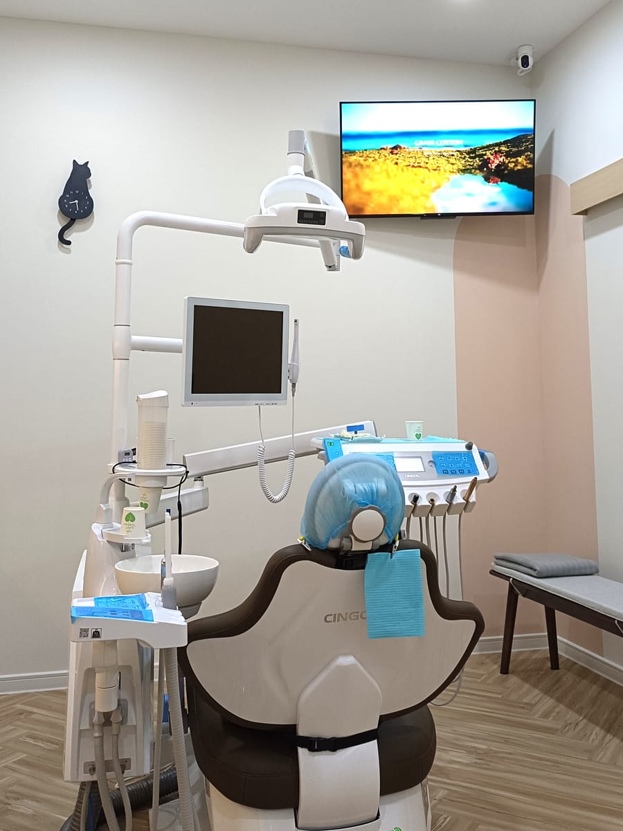 Treatment room with an entertainment TV for patient comfort at Alpha Dental, Sutera Utama, Skudai