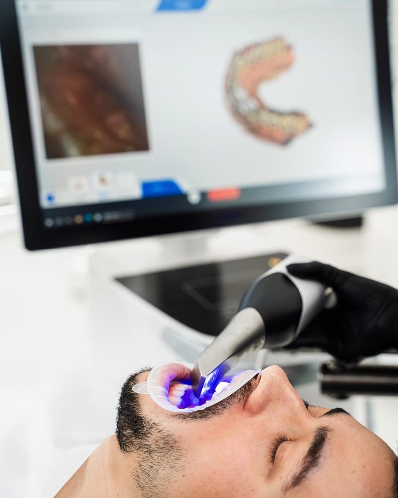Patient having a 3D digital scan taken with an intraoral scanner at Alpha Dental, Sutera Utama